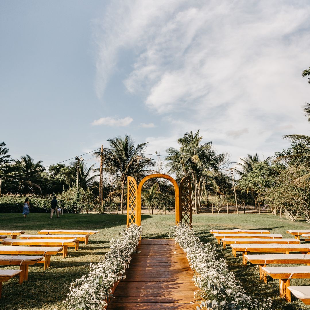 An outdoor wedding venue with many flowers